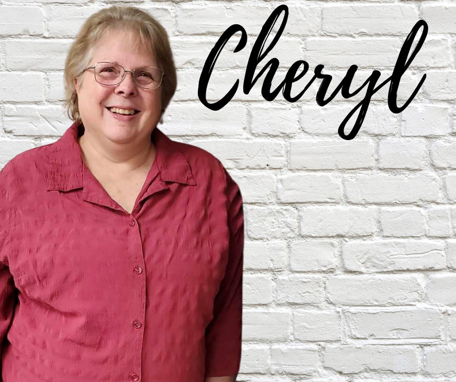 FLIC Bookkeeper Cheryl Baker Finger Lakes Independence Center Bookkeeper Cheryl Baker in front of a white brick wall with first name in black letters