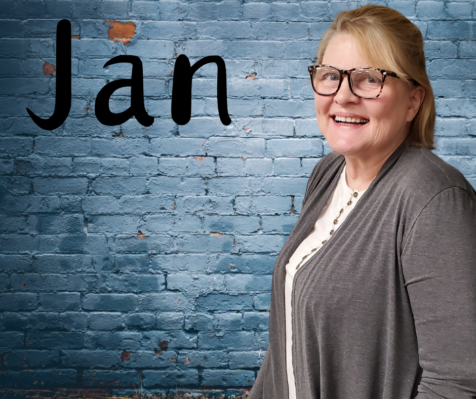FLIC Executive Director Jan Lynch Finger Lakes Independence Center Executive Director Jan Lynch in front of a grey brick wall with first name in black letters