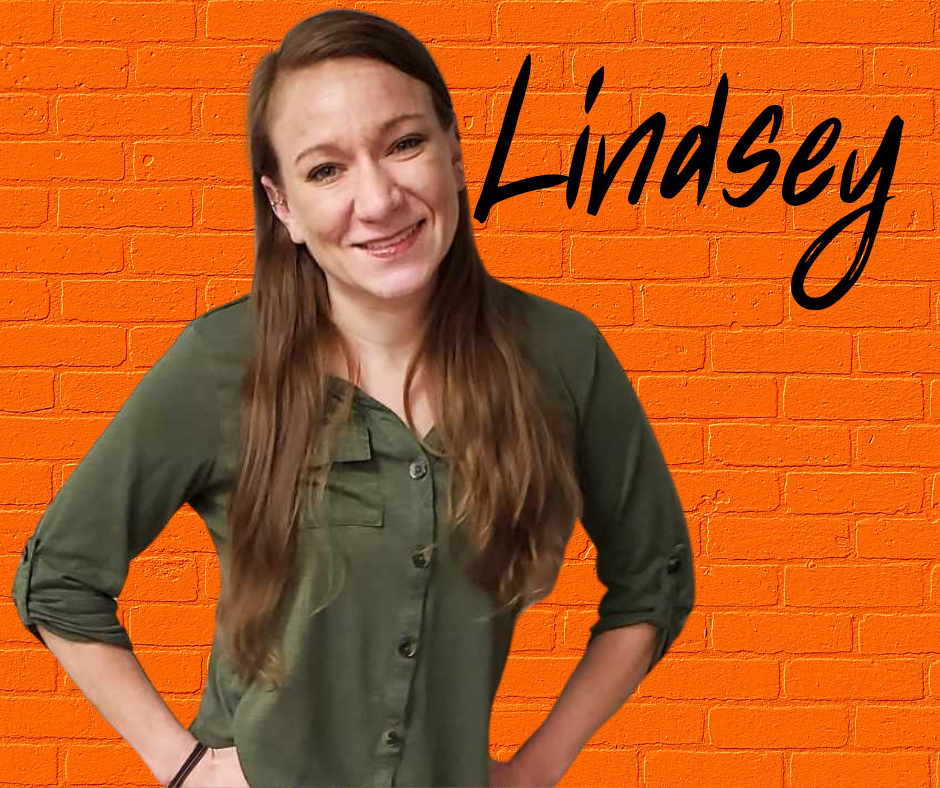 FLIC Administrative Assistant Lindsey Smith Finger Lakes Independence Center Administrative Assistant Lindsey Smith in front of a orange brick wall with first name in black letters