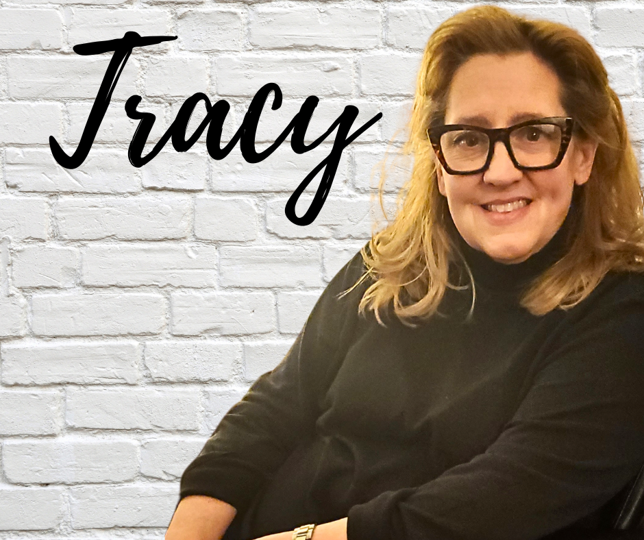 FLIC Chief Operations Officer Tracy Decker Finger Lakes Independence Center Executive Director Jan Lynch in front of a white brick wall with first name in black letters